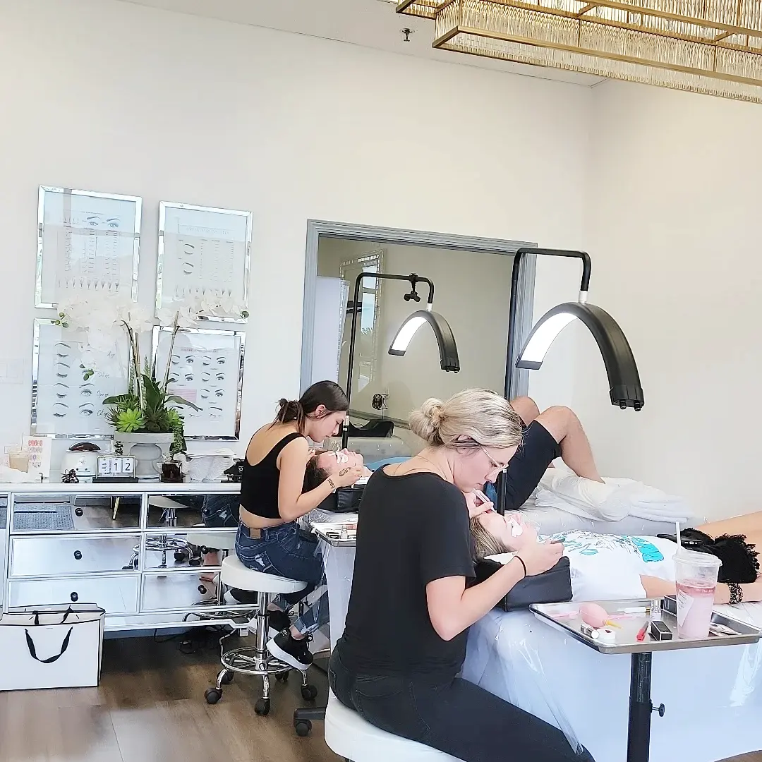 Students with live models inside the iBrow iLash studio in Waukee, Iowa